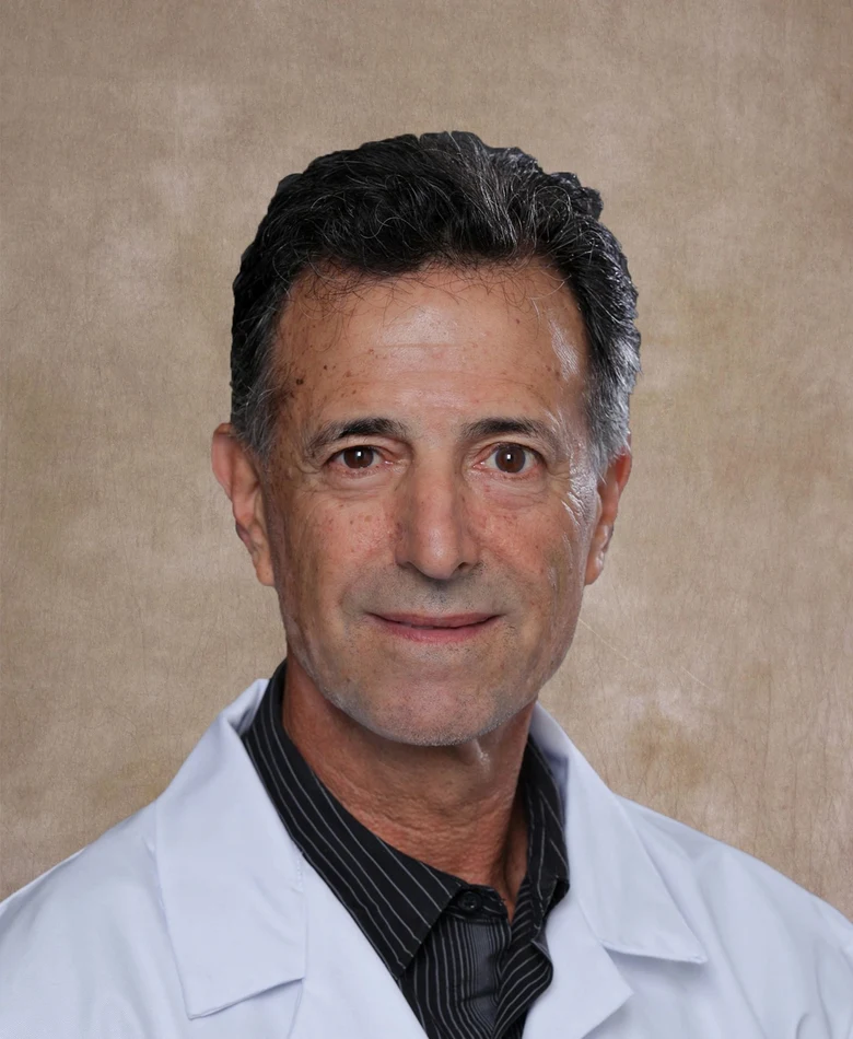 Dr. Alan Seifer in his white physician's coat